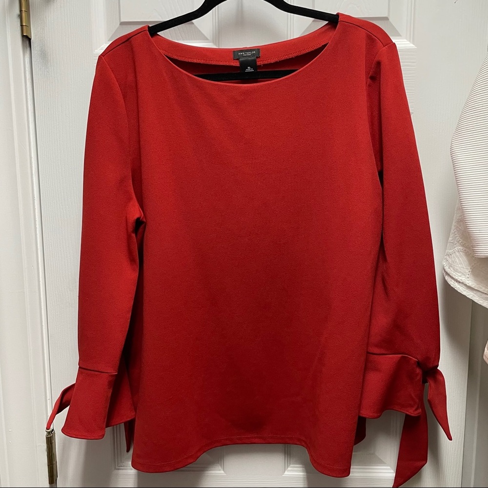 Burnt orange top with bows on sleeve